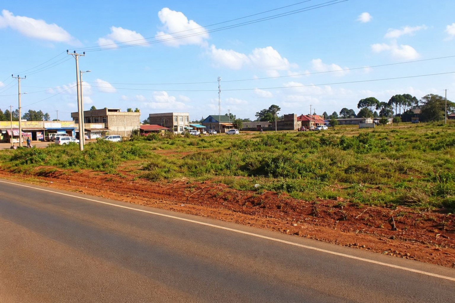 Road-facing mixed-use land parcel near a growing town centre